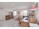 Home office with multiple desks, shelving, and ample natural light at 11616 Solstice Way, Huntersville, NC 28078