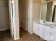 Bathroom with dual vanity sinks, neutral tile floor, and a separate toilet and closet area at 12031 Brownestone View Dr, Charlotte, NC 28269