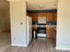 Charming kitchen features wood cabinets, modern appliances, and a bright, functional layout at 12031 Brownestone View Dr, Charlotte, NC 28269