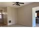 Open-concept living room featuring neutral paint, adjacent kitchen, and ample natural light at 12031 Brownestone View Dr, Charlotte, NC 28269