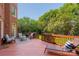 Relaxing back deck surrounded by lush greenery, furnished with comfortable outdoor seating at 12122 Camden Trail Ct, Charlotte, NC 28277