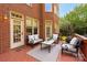 Inviting outdoor deck with cozy seating, perfect for relaxation and entertaining near brick home at 12122 Camden Trail Ct, Charlotte, NC 28277