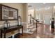 Grand foyer with hardwood floors, staircase, elegant console table, and abundant natural light at 12122 Camden Trail Ct, Charlotte, NC 28277
