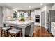Bright kitchen boasts a large island with quartz countertops and stainless steel appliances at 12122 Camden Trail Ct, Charlotte, NC 28277