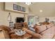 Cozy living room featuring comfortable seating, a large television, and access to another room at 12122 Camden Trail Ct, Charlotte, NC 28277