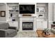 Bright living room features built-in shelving and a fireplace at 12122 Camden Trail Ct, Charlotte, NC 28277