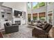 Spacious living room features a fireplace, built-in shelving, and large windows at 12122 Camden Trail Ct, Charlotte, NC 28277