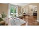 Bright living room with hardwood floors, comfortable seating, and scenic views at 12122 Camden Trail Ct, Charlotte, NC 28277