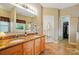 Bathroom with double sink, granite countertops, walk-in closet and tile floors at 13505 Michael Lynn Rd, Charlotte, NC 28278