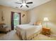 Cozy bedroom with carpeted floors, ceiling fan, and natural light at 13505 Michael Lynn Rd, Charlotte, NC 28278