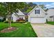 Charming home featuring a manicured lawn and beautiful landscaping at 13505 Michael Lynn Rd, Charlotte, NC 28278