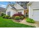 Charming home featuring lush landscaping around the front entrance at 13505 Michael Lynn Rd, Charlotte, NC 28278
