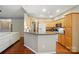Open kitchen with breakfast bar and wood cabinets at 13505 Michael Lynn Rd, Charlotte, NC 28278