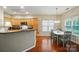 Cozy kitchen with breakfast bar, adjacent to dining area and windows at 13505 Michael Lynn Rd, Charlotte, NC 28278