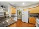Traditional kitchen with granite counters, wood floors, light wood cabinets and stainless steel appliances at 13505 Michael Lynn Rd, Charlotte, NC 28278