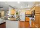 Open kitchen with breakfast bar and wood cabinets at 13505 Michael Lynn Rd, Charlotte, NC 28278