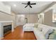 Open-concept living room with a fireplace and modern sofa at 13505 Michael Lynn Rd, Charlotte, NC 28278
