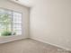 Bright bedroom featuring a sunny window and neutral colors, creating a peaceful ambiance at 1488 River Bend Blvd, Fort Mill, SC 29707