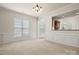 Elegant dining area with wainscoting and large window, offering a bright space for meals at 1488 River Bend Blvd, Fort Mill, SC 29707
