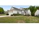 Charming home featuring a well-manicured lawn, attached two-car garage, and inviting architectural details at 1488 River Bend Blvd, Fort Mill, SC 29707