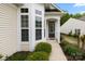 Welcoming front entrance with elegant windows and landscaped surroundings at 1488 River Bend Blvd, Fort Mill, SC 29707