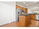 Spacious kitchen with stainless steel refrigerator, eat-in island, and wooden cabinetry at 1488 River Bend Blvd, Fort Mill, SC 29707