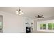 Bright living room featuring a fireplace, built-in shelving and a ceiling fan, creating a cozy atmosphere at 1488 River Bend Blvd, Fort Mill, SC 29707