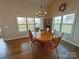 Charming dining room featuring a wood table, ample natural light, and hardwood floors, perfect for gatherings at 164 Castle Pines Ln, Statesville, NC 28625