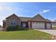Beautiful home featuring a stone facade, three-car garage, and well-maintained lawn, offering curb appeal and space at 164 Castle Pines Ln, Statesville, NC 28625