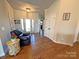 Welcoming foyer showcasing hardwood floors, natural light, and an inviting view into the home, creating a warm entrance at 164 Castle Pines Ln, Statesville, NC 28625
