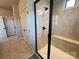 An elegant glass-enclosed shower with tiled walls and a built-in seat for added comfort at 164 Castle Pines Ln, Statesville, NC 28625