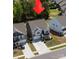 Inviting two-story home with a well-manicured lawn and a long driveway leading to an attached two-car garage at 184 Tetcott St, Mooresville, NC 28115