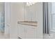 Bathroom with granite counters, white vanity, large mirror, and a window with grey curtains at 184 Tetcott St, Mooresville, NC 28115