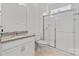 Clean bathroom with white cabinets, granite countertop and framed shower at 184 Tetcott St, Mooresville, NC 28115