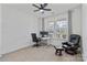 Bright bedroom with neutral carpet, featuring a ceiling fan and a large window for plenty of natural light at 184 Tetcott St, Mooresville, NC 28115