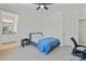Bedroom features a ceiling fan, neutral-toned walls and carpet, and an ensuite bathroom at 184 Tetcott St, Mooresville, NC 28115