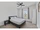 This carpeted bedroom features a ceiling fan, a large window, and ample natural light at 184 Tetcott St, Mooresville, NC 28115