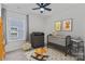 bedroom includes a crib, changing table, rocking horse and giraffe and tiger wall art at 184 Tetcott St, Mooresville, NC 28115