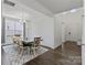 Elegant dining room featuring hardwood floors, a modern chandelier, and large window for natural light at 184 Tetcott St, Mooresville, NC 28115
