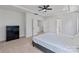 This main bedroom features a walk-in closet, neutral colors, and carpeted floors at 184 Tetcott St, Mooresville, NC 28115