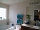 Bright bathroom featuring a garden tub and large mirror at 1960 Aston Mill Pl, Charlotte, NC 28273