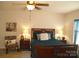 Cozy bedroom with a decorative pillow, window and ceiling fan at 1960 Aston Mill Pl, Charlotte, NC 28273
