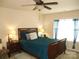 Spacious bedroom with a ceiling fan and large window at 1960 Aston Mill Pl, Charlotte, NC 28273