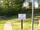 Community dog park at the Mews features picnic tables and a fenced area for pets at 1960 Aston Mill Pl, Charlotte, NC 28273