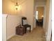 Hallway with chair and accent table leading to a naturally lit room at 1960 Aston Mill Pl, Charlotte, NC 28273