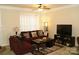 Inviting living room featuring neutral walls, ceiling fan, and comfortable seating arrangement at 1960 Aston Mill Pl, Charlotte, NC 28273