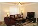 Inviting living room featuring neutral walls, ceiling fan, and comfortable seating arrangement at 1960 Aston Mill Pl, Charlotte, NC 28273