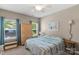 This bedroom features two windows with curtains, a closet and a comfortable bed at 2002 Thurston Dr, Indian Trail, NC 28079