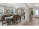 Dining room with decorative chairs flowing into main living area at 2002 Thurston Dr, Indian Trail, NC 28079