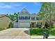 Charming two-story home with a three-car garage, beautiful lawn, and a convenient mailbox at 2002 Thurston Dr, Indian Trail, NC 28079